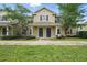 Inviting two-story townhome with manicured lawn, mature trees, and a charming covered entryway at 944 Regatta Bay Dr # 12-102, Orange City, FL 32763