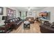 Cozy living room featuring hardwood floors, comfortable seating, and natural lighting at 944 Regatta Bay Dr # 12-102, Orange City, FL 32763