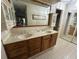 Bathroom with a double sink vanity, neutral countertops, and tiled floors at 96 Old Barn Trl, Ormond Beach, FL 32174