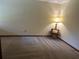 Carpeted bedroom featuring a lamp on side table with outlets available at 96 Old Barn Trl, Ormond Beach, FL 32174