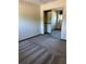 Bright bedroom featuring mirrored closet doors, neutral walls, and soft carpeting at 96 Old Barn Trl, Ormond Beach, FL 32174