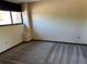 Cozy bedroom with wall to wall carpet, a large window, and neutral paint at 96 Old Barn Trl, Ormond Beach, FL 32174
