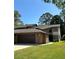 Two-story home with a brick front, attached garage and well-maintained lawn at 96 Old Barn Trl, Ormond Beach, FL 32174