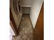 A view of a hallway with patterned tile and closet for extra storage at 96 Old Barn Trl, Ormond Beach, FL 32174