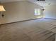 Expansive living room featuring vaulted ceilings and ample natural light from large windows at 96 Old Barn Trl, Ormond Beach, FL 32174