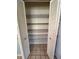 Pantry with open shelving, offering ample storage for groceries and kitchen essentials at 96 Old Barn Trl, Ormond Beach, FL 32174