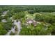Scenic aerial view of a residential neighborhood with mature trees and well-maintained streets near a golf course at 978 Victoria Hills S Dr, Deland, FL 32724