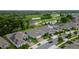 Aerial view of homes in a community, showcasing lush greenery, ponds, and a glimpse of a golf course at 978 Victoria Hills S Dr, Deland, FL 32724