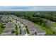 An aerial view shows a residential area featuring tree-lined streets, well-maintained homes, and green spaces at 978 Victoria Hills S Dr, Deland, FL 32724