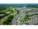 An aerial view of a residential neighborhood near a golf course with ponds and wooded areas at 978 Victoria Hills S Dr, Deland, FL 32724