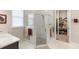 Modern bathroom featuring a glass-enclosed shower, storage, and contemporary finishes at 978 Victoria Hills S Dr, Deland, FL 32724
