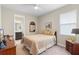 Cozy bedroom adjacent to the primary bathroom features natural light and serene decor at 978 Victoria Hills S Dr, Deland, FL 32724