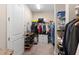 Walk-in closet with lots of shelves, hanging racks and drawer space for optimal organization at 978 Victoria Hills S Dr, Deland, FL 32724