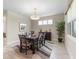 Relaxed dining room featuring a dark wood table and light-filled windows at 978 Victoria Hills S Dr, Deland, FL 32724