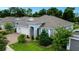 Beautiful single-story home with a three-car garage, brick paver driveway, and lovely landscaping at 978 Victoria Hills S Dr, Deland, FL 32724