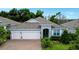 Charming single-Gathering home featuring a three-car garage, paver driveway, and well-manicured landscaping at 978 Victoria Hills S Dr, Deland, FL 32724