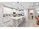 Stylish kitchen with a center island, pendant lighting, stainless steel appliances, and seating area at 978 Victoria Hills S Dr, Deland, FL 32724