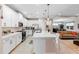 Open-concept kitchen with a large island, pendant lights, and seamless transition to the living area at 978 Victoria Hills S Dr, Deland, FL 32724