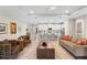 Bright open-plan living room featuring an eat-in kitchen with white cabinetry and a zebra-striped rug at 978 Victoria Hills S Dr, Deland, FL 32724