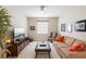 Cozy living room featuring plush carpet, neutral paint, and lots of natural light at 978 Victoria Hills S Dr, Deland, FL 32724