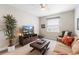 Cozy living room featuring plush carpet, neutral paint, and lots of natural light at 978 Victoria Hills S Dr, Deland, FL 32724