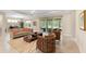 Inviting living room with patio access, cozy seating, and view of dining area at 978 Victoria Hills S Dr, Deland, FL 32724