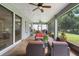 Spacious screened patio with comfortable seating areas and views of the lush backyard at 978 Victoria Hills S Dr, Deland, FL 32724