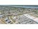 Sprawling aerial perspective of residential areas near commercial shopping centers and a scenic river at 10 Lynnhurst Dr # 1050, Ormond Beach, FL 32176