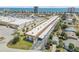 Aerial view of condo building, nearby ocean, shopping, and parking at 10 Lynnhurst Dr # 1050, Ormond Beach, FL 32176