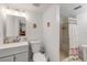 Fresh bathroom featuring a vanity with sink, toilet, and a shower with patterned curtain and bench at 10 Lynnhurst Dr # 1050, Ormond Beach, FL 32176