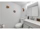 Simple bathroom featuring a sink, toilet, and colorful tropical fish decorations for a touch of whimsy at 10 Lynnhurst Dr # 1050, Ormond Beach, FL 32176