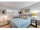 Serene bedroom with a comfortable bed, bright window, and stylish nightstands for a relaxing ambiance at 10 Lynnhurst Dr # 1050, Ormond Beach, FL 32176