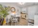 Bright dining area featuring new floors, table, and chairs at 10 Lynnhurst Dr # 1050, Ormond Beach, FL 32176