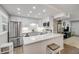 Bright kitchen featuring quartz countertops, stainless steel appliances, and seamless access to the living area at 10 Lynnhurst Dr # 1050, Ormond Beach, FL 32176