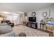 Spacious living room with ample seating and tv, with new floors at 10 Lynnhurst Dr # 1050, Ormond Beach, FL 32176