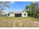 A fenced-in backyard featuring grass and shade trees at 1018 E Gaucho Cir, Deltona, FL 32725