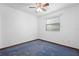 Bright bedroom featuring carpet floors and ceiling fan at 1018 E Gaucho Cir, Deltona, FL 32725