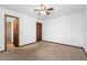 Bedroom featuring neutral carpet with a view of the ensuite bathroom at 1018 E Gaucho Cir, Deltona, FL 32725