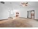 Bright, open-concept living area with updated lighting fixtures and a seamless flow to the kitchen at 1018 E Gaucho Cir, Deltona, FL 32725