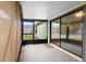 Enclosed patio featuring a screened-in area and sliding glass doors at 1018 E Gaucho Cir, Deltona, FL 32725