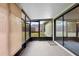Enclosed patio featuring a screened-in area and sliding glass doors at 1018 E Gaucho Cir, Deltona, FL 32725