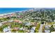 This beautiful neighborhood features lush greenery, well-maintained yards, and a stunning view of the ocean in the background at 1027 Bel Aire Dr, Daytona Beach, FL 32118
