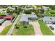 An aerial view showcases a home's landscaping, driveway, and location within the community at 1027 Bel Aire Dr, Daytona Beach, FL 32118