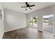 This bedroom has hard surface floors and glass doors overlooking the pool at 1027 Bel Aire Dr, Daytona Beach, FL 32118