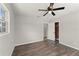 This bedroom features wood-look floors, a ceiling fan, and closet at 1027 Bel Aire Dr, Daytona Beach, FL 32118