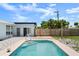 This backyard view showcases a refreshing in-ground pool with a patio, great for outdoor relaxation at 1027 Bel Aire Dr, Daytona Beach, FL 32118