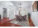 Bright dining room featuring a decorative rug, chandelier, and large windows for natural light at 1205 Weeping Willow Dr, Deland, FL 32724