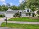 Charming home with a well-manicured lawn and lush landscaping, showcasing curb appeal at 1205 Weeping Willow Dr, Deland, FL 32724