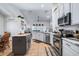 Bright kitchen with stainless steel appliances, an island, and lots of cabinet space at 1205 Weeping Willow Dr, Deland, FL 32724