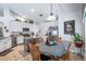 Kitchen with stainless steel appliances, an island, and an eat-in dining area at 1205 Weeping Willow Dr, Deland, FL 32724